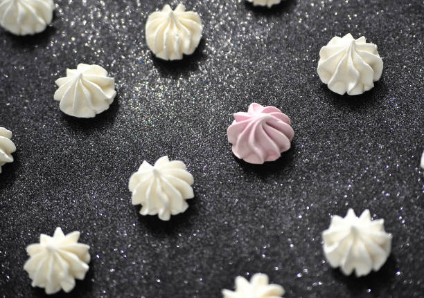 istock Meringues in plate on dark background. 1291214787