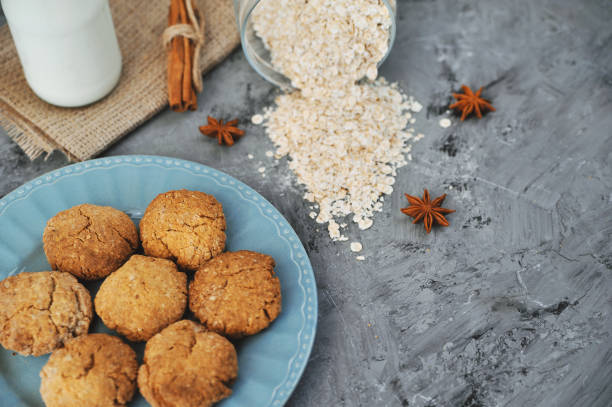 istock Oat cookies with ingredients on wooden background. 1291221924