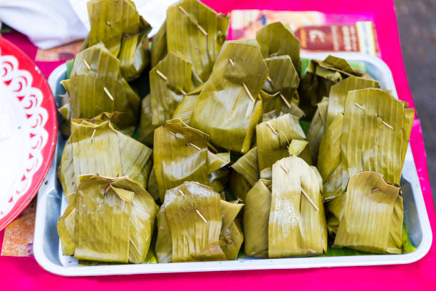 istock Steamed chicken with curry paste wrap with banana leaf 1291225294