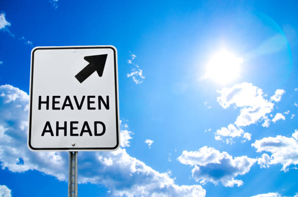 istock Road sign with message of Heaven ahead 1291229778