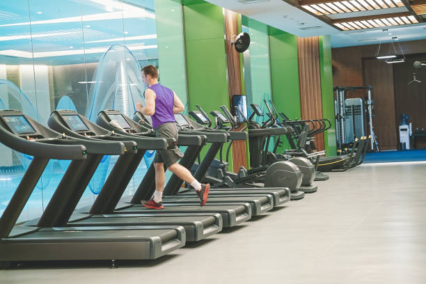 istock Running on treadmill at gym 1291231022