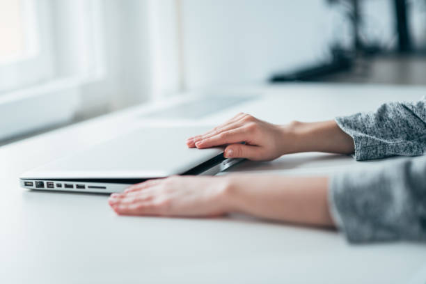 istock Ready to work. Female person's hands opening laptop. 1291232200