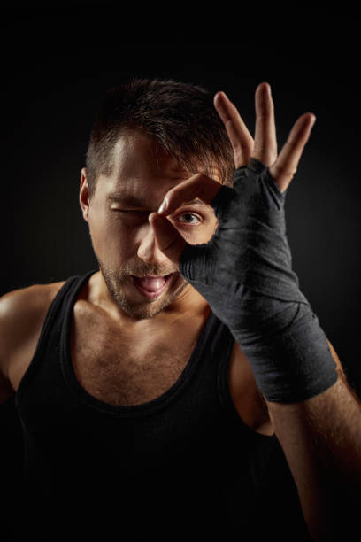 istock Handsome fit young bearded man showing Ok gesture 1291233548