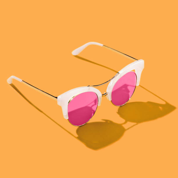 istock Marigold colored background with retro sunglasses. 1291233646