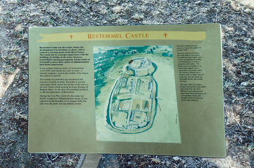 25 July 2018 - Lostwithiel, Corwall, UK: Restormel Castle Sign entrance. This is one of the four chief Norman castles of Cornwall. The castle is notable for its circular design; it was the residence of The Earl of Cornwall but became ruined in the 16th century.