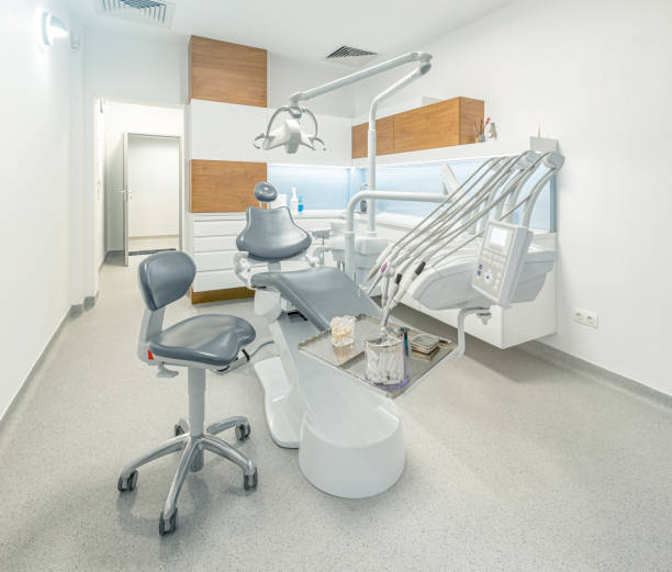 istock Dentist tools and professional dentistry chair 1291235123