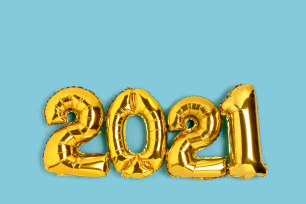 istock 2021 made from gold balloons on a blue background. 1291236800