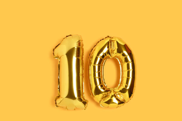 istock Number 10 golden balloons with place for text. 1291236911