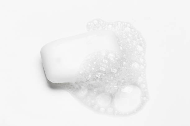 istock Soap bar and foam on white background, top view. Mockup for design 1291237402