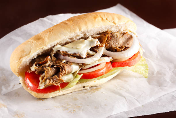istock Steak and cheese sandwich on parchment paper 1291237715