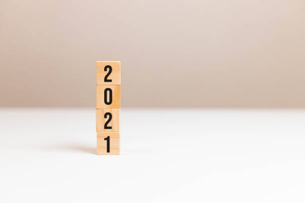 istock Wooden cubes block with 2021 text on table background. Way, quick solution, idea, imagination, concept, building, business, create concept 1291237937