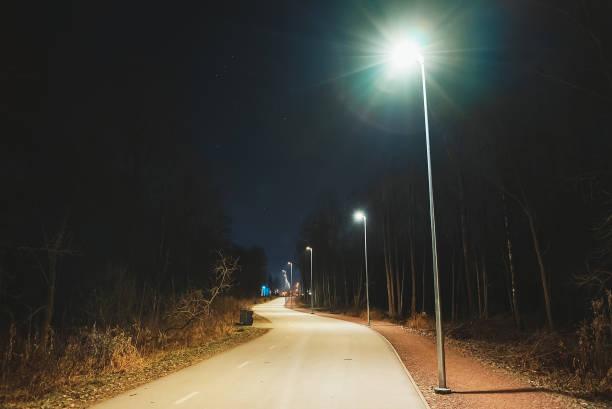 istock Walking path with illumination at night. Tondiraba park, Lasnamae, Tallinn. 1291239928