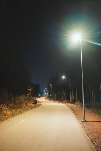 istock Walking path with illumination at night. Tondiraba park, Lasnamae, Tallinn. 1291239933