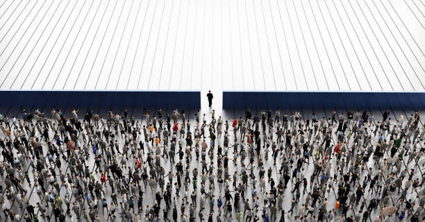Businessman, a leader going through the wall. Crowd of people behind him. 3D illustration