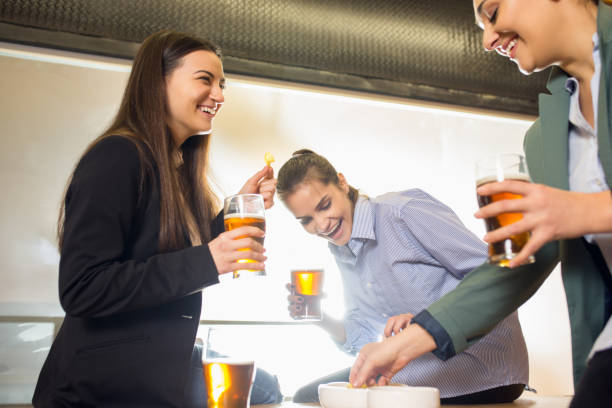 istock Happy co-workers celebrating corporate event after tensioned work day. Look delighted, friendly, cheerful 1291244013