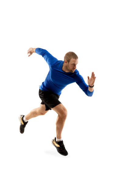 istock Caucasian professional runner, jogger training isolated on white studio background in fire 1291244614
