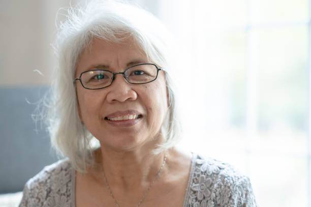 istock Senior Filipino female smiling at camera 1291245381