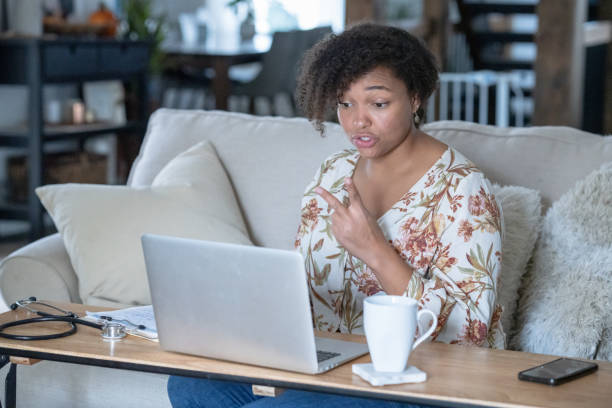 istock African American female working from home during pandemic 1291245407