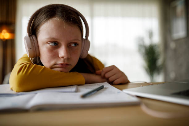 istock Bored school girl having online class 1291246792