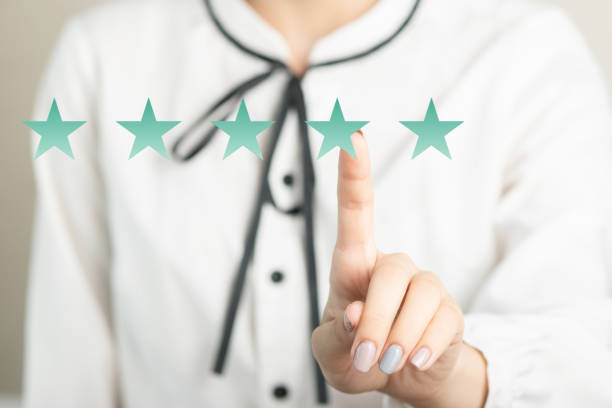 istock Women's hands and star rating icon 1291246807