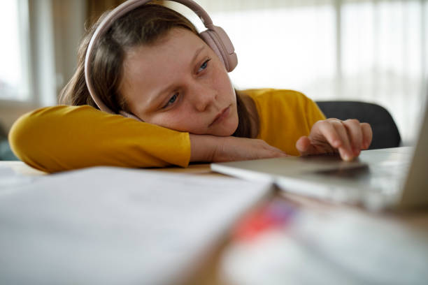 istock Bored school girl having online class 1291247667