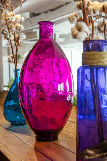 istock Glass vases with cotton sprigs closeup 1291247690