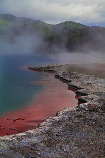 Vivid colors of the Champagne Pool, a hot spring Waiotapu geothermal area near Rotorua on the North Island of New Zealand.