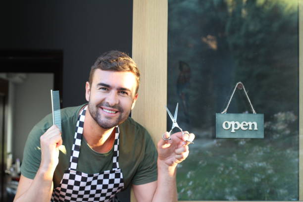 istock Hairstylist holding comb and scissors 1291248509