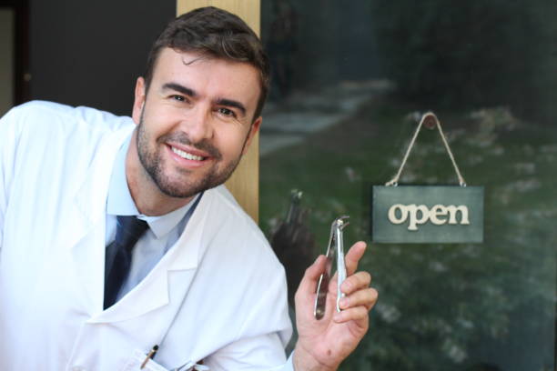 istock Spooky male dentist holding pliers 1291249537