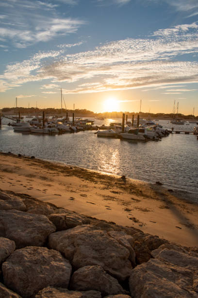 istock Dusk in a port with big clouds 1291251995