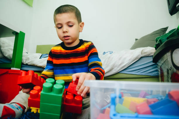 istock Little boy playing with blocks stock photo 1291252872