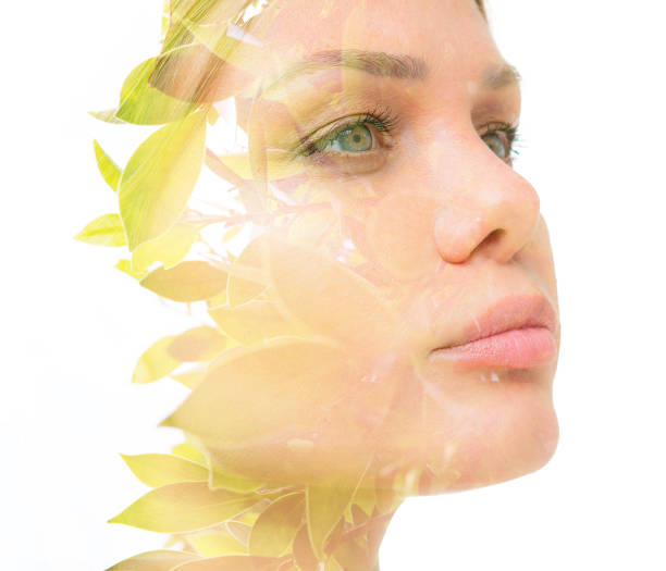 istock A confident young woman's double exposure portrait close up against white bakcground 1291256885