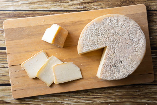 istock Artisanal Canastra cheese from Minas Gerais, Brazil over wooden table 1291257015