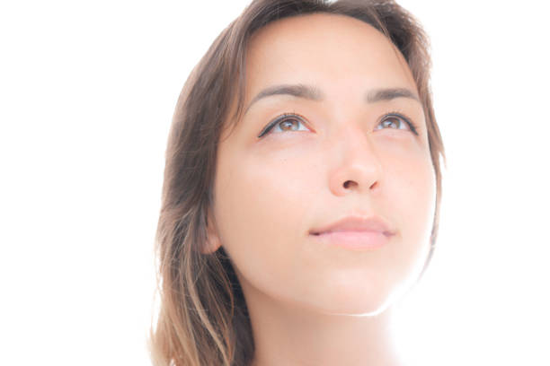 Young woman with clean, fresh skin. Space for copy.