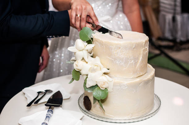 istock The wedding cake. Wedding buffet. Cake decorated with roses 1291257322