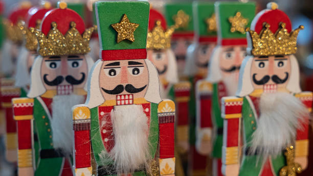 istock Soldier Nutcracker Statues. Decorative toy wooden nutcracker in store during Christmas holidays. Happy New Year concept. 1291258227