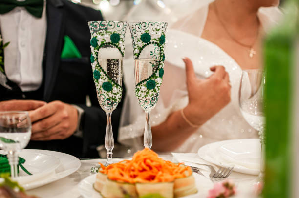 istock wedding champagne glasses with green heart 1291258435