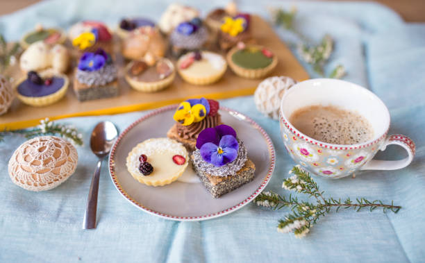 istock Cup of coffee and desserts on table, close-up. 1291260764