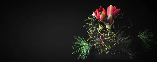 beautiful flower arrangement with amaryllis blossom isolated on black background