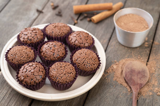 istock Typical brazilian brigadeiros, various flavors over wooden table 1291262385