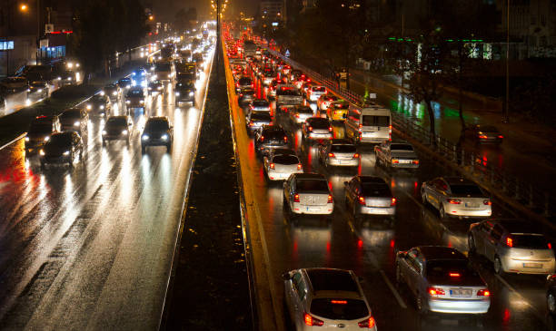 istock Busy traffic jam at rainy night. 1291263181