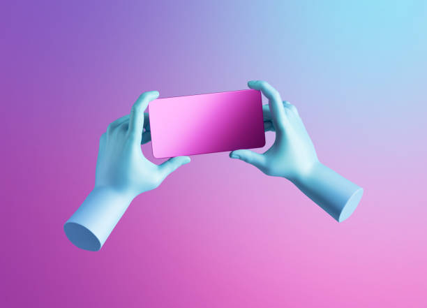 istock 3d render, blue hands hold card or smart phone digital device in horizontal position. Electronic gadget blank mockup isolated on pink background. Mobile gaming technology 1291263436