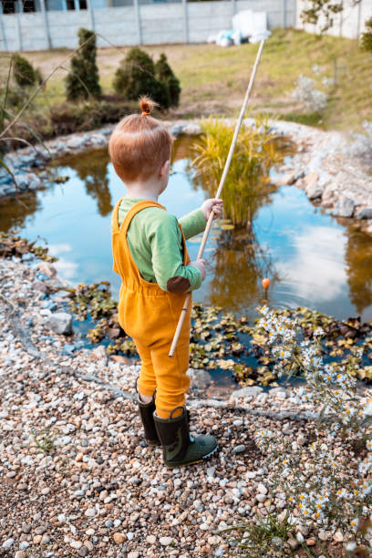 istock Redhead Toddler boy is fishing alone 1291264432