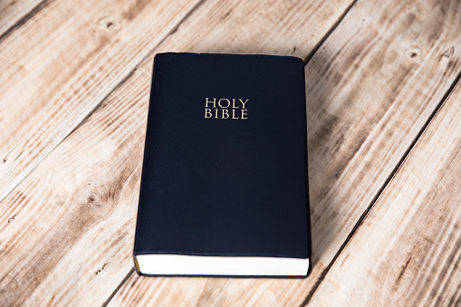 Holy Bible on wooden background