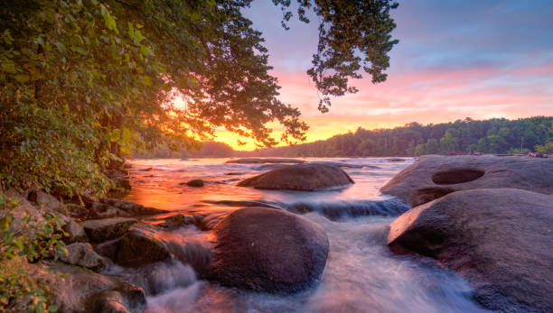 A stunning sunset on the James River lights up the sky