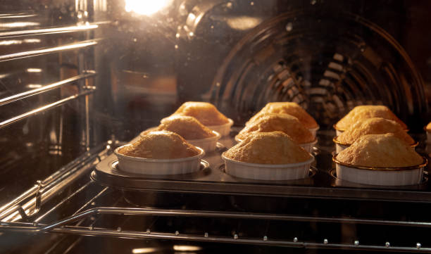 istock Fresh cupcakes are baked in the oven. Selective focus. 1291269322