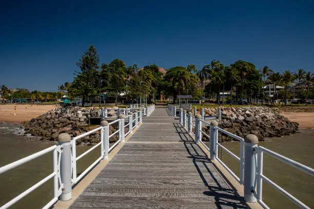 Townsville, Australia - September 1, 2020: Looking back at The Strand and Castle Hill from the Strand Pier in the Far North Queensland city of Townsville.