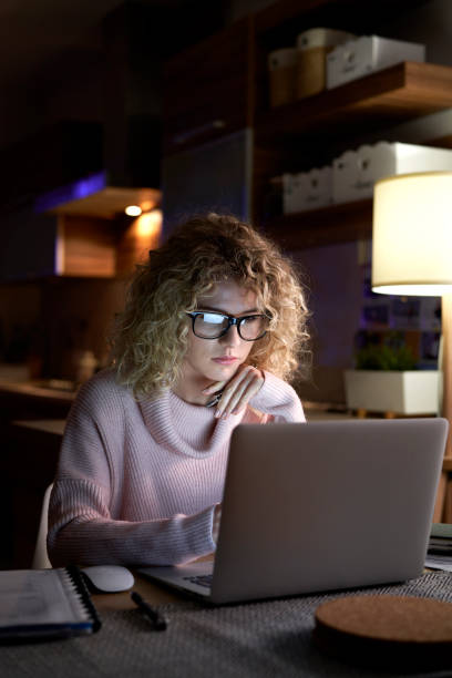 istock Woman working at home in the evening 1291270664