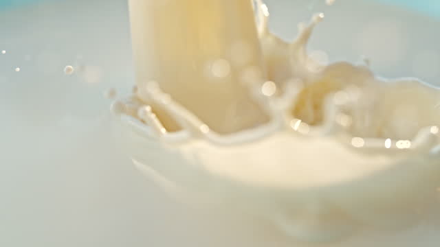 SUPER SLO MO Close up shot of poured milk