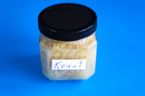 Jar of Sauerkraut, Vibrant Blue Background